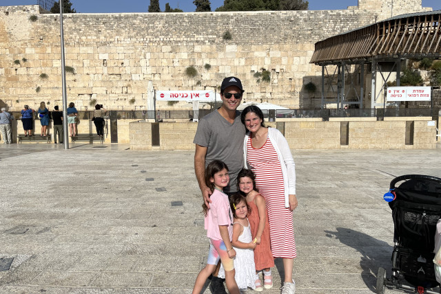  LOUISE SUTTON SUEDE poses with her family, who all made aliyah in August, at the Kotel ahead of the new year.  (photo credit: Courtesy of those mentioned)