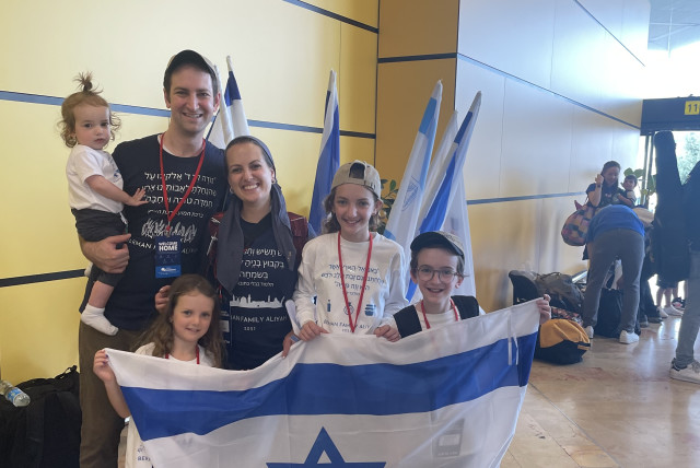  RIVKI BERMAN and her family smile big at Ben-Gurion Airport upon making aliyah last month.  (credit: Courtesy of those mentioned)