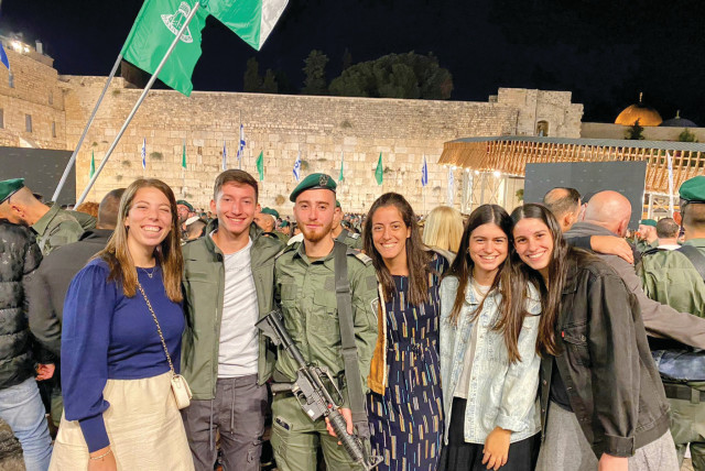  A GRADUATE at his IDF swearing-in ceremony at the Western Wall, with a fellow graduate and Bet Elazraki staff. (credit: Yosi Dinershtain, Zili Shafir)