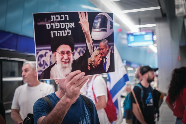  DEMONSTRATORS AT Tel Aviv’s Carlebach Station protest against the decision to not operate the new light rail on Shabbat. The placard reads: ‘Express train to Tehran.’ (photo credit: AVSHALOM SASSONI/FLASH90)