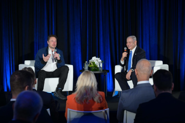  Israeli Prime Minister Benjamin Netanyahu is seen speaking with Tesla CEO Elon Musk, on September 18, 2023. (credit: Avi Ohayon/GPO)