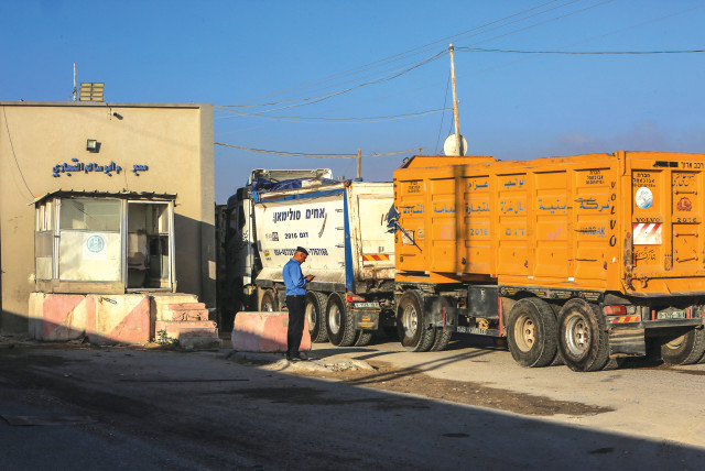 TRUCKS CROSS at Kerem Shalom, the main passage point for goods entering the Gaza Strip from Israel.  (credit: ABED RAHIM KHATIB/FLASH90)