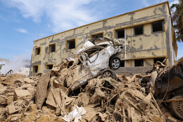  A destroyed car sits on top of a pile of rubble, following fatal floods in Derna, Libya, September 17, 2023REUTERS/Amr Alfiky (credit: REUTERS/AMR ALFIKY)