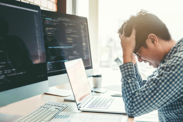  Developing programmer stressed out of work (illustrative). (credit: INGIMAGE)
