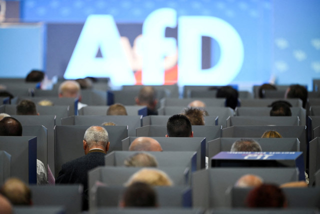  AfD members sit in voting booths on the day of the European election assembly 2023 of the Alternative for Germany (AfD) in Magdeburg, Germany, July 29, 2023.  (credit: REUTERS/ANNEGRET HILSE)