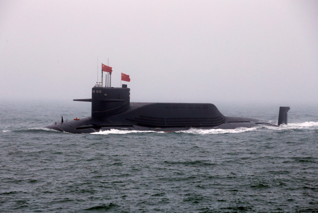  Chinese Navy's nuclear-powered submarine Long March 11 takes part in a naval parade off the eastern port city of Qingdao, to mark the 70th anniversary of the founding of Chinese People's Liberation Army Navy, China, April 23, 2019. (credit: REUTERS/JASON LEE/FILE PHOTO)