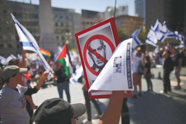  DEMONSTRATORS, INCLUDING one carrying a Palestinian flag, hold a protest against Prime Minister Benjamin Netanyahu during his meeting in San Fransisco with Elon Musk on September 18. (photo credit: Carlos Barria/Reuters)