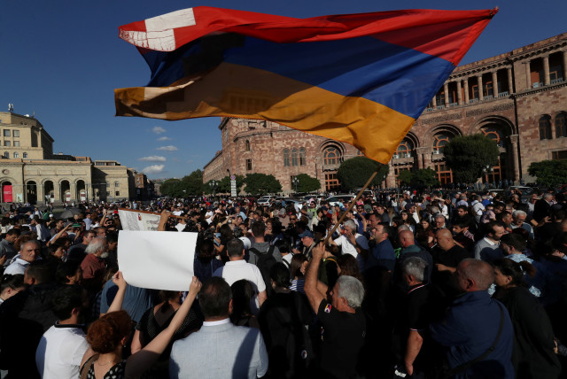  Protesters gather near the government building, after Azerbaijan launched a military operation in the region of Nagorno-Karabakh, in Yerevan, Armenia, September 19, 2023 (photo credit: Vahram Baghdasaryan/Photolure via REUTERS)