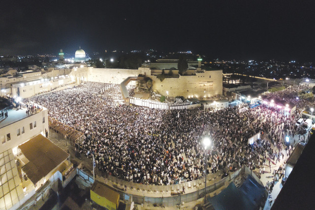  TENS OF THOUSANDS of worshipers recite Slihot prayers at the Western Wall in the early hours of Friday ahead of Yom Kippur, which starts this evening, as viewed from the rooftop of the Aish World Center that overlooks the plaza. (credit: MARC ISRAEL SELLEM)