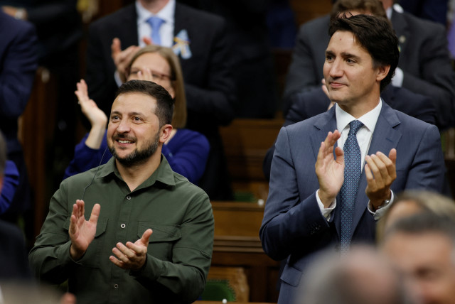  Canadian Prime Minister Justin Trudeau and Ukraine's President Volodymyr Zelenskiy react following his speech at the House of Commons on Parliament Hill in Ottawa, Ontario, Canada September 22, 2023. (credit: REUTERS/Blair Gable/Pool)