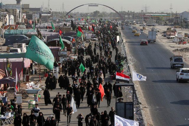  Shi'ite Muslim pilgrims walk to the holy city of Kerbala, ahead of the holy Shi'ite ritual of Arbaeen, in Baghdad, Iraq September 3, 2023 (credit: REUTERS/AHMED SAAD)