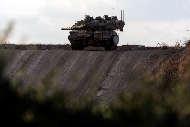  An Israeli tank is positioned near the border between Israel and the Gaza Strip during clashes between Palestinian protesters and Israeli soldiers, as it is seen from the Israeli side September 20, 2023 (photo credit: AMIR COHEN/REUTERS)