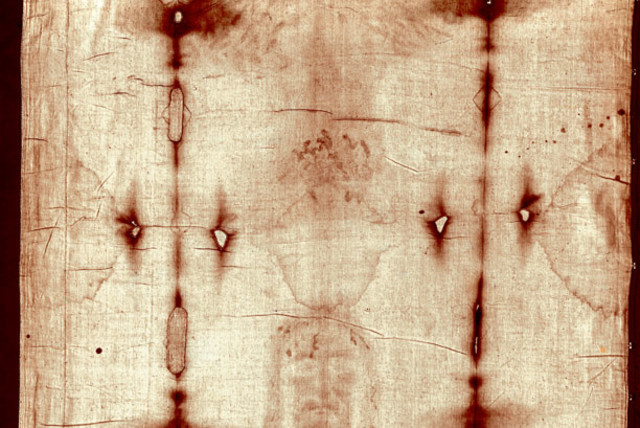  Full-length photograph of the Shroud of Turin which is said to have been the cloth placed on Jesus at the time of his burial. (credit: Wikimedia Commons)