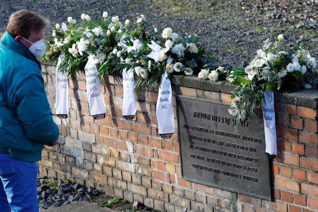  Wreaths are pictured at the Gleis 17 (Platform 17) memorial, a platform at Berlin-Grunewald train station from where Jewish citizens were deported by train to the Nazi concentration camps between 1941 and 1945, in Berlin, Germany, January 27, 2021 (photo credit: REUTERS/FABRIZIO BENSCH)