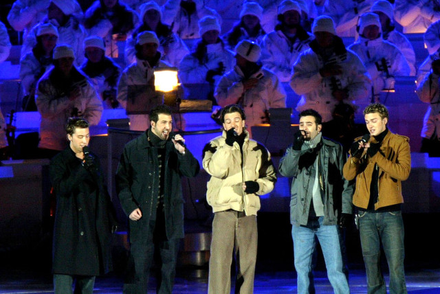  'NSYNC perform at Rice-Eccles Stadium during the closing ceremony of the Salt Lake 2002 Olympic Winter Games, February 24, 2002. (credit: REUTERS)