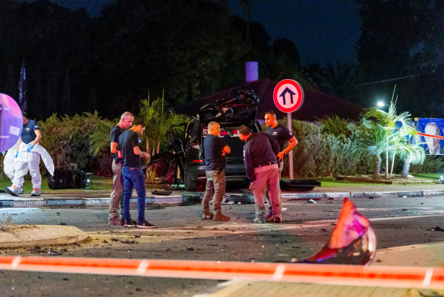  Police officers at the scene where one person was killed and two were injured in a car bomb assassination in Moshav Hatsav, October 1, 2023.  (credit: LIRON MOLDOVAN/FLASH 90)