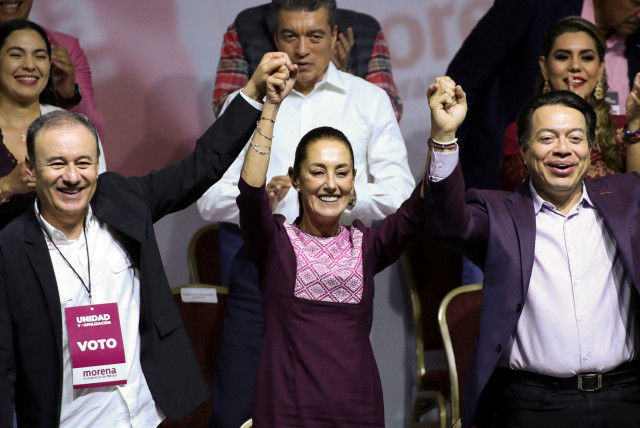  Former Mexico City Mayor Claudia Sheinbaum gestures next to President of the ruling National Regeneration Movement (MORENA) party Mario Delgado and President of the National Council of the MORENA party Alfonso Durazo, on the day she is certified as presidential candidate for the ruling National Reg (credit: REUTERS/HENRY ROMERO)