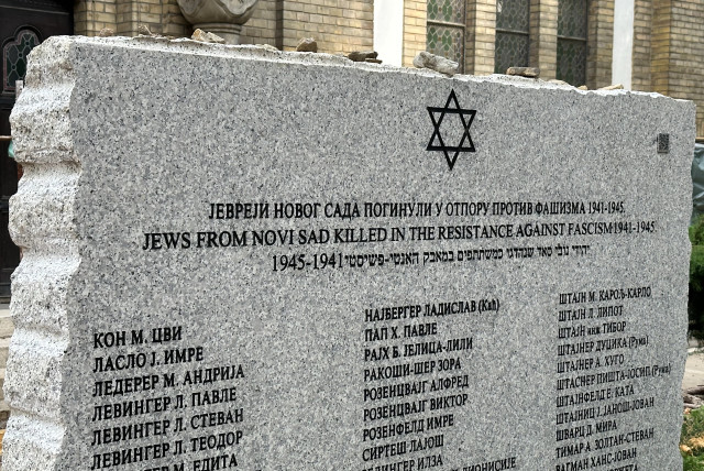  A memorial in the courtyard of the synagogue in Novi Sad, Serbia’s second-largest city, lists the names of Jewish partisans killed while fighting the Nazis during World War II.  (credit: LARRY LUXNER/JTA)