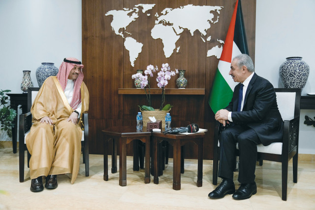  NAYEF AL-SUDAIRI, Saudi Arabia’s first-ever ambassador to the Palestinian Authority, speaks with PA Prime Minister Mohammad Shtayyeh in Ramallah last month. (credit: Majdi Mohammed/Pool/REUTERS)