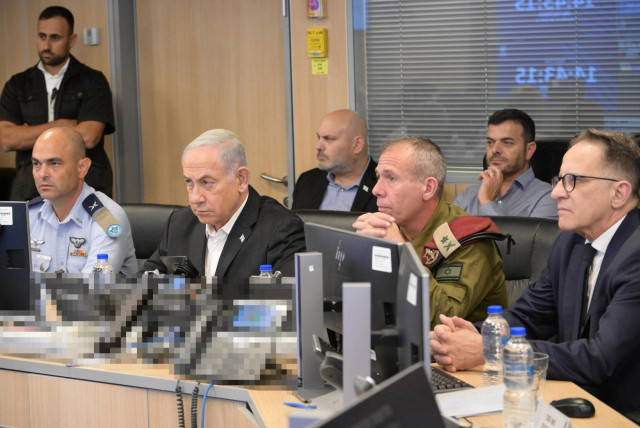   Israeli Prime Minister Benjamin Netanyahu with senior military officers in an Israeli Air Force war room, October 8, 2023. (credit: AMOS BEN-GERSHOM/GPO)