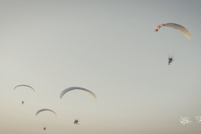  Hamas's armed wing Izz el-Deen al-Qassam Brigades train with paragliders as they prepare for an armed air assault, in this screengrab obtained from a social media video released on October 7, 2023. (credit: Izz el-Deen al-Qassam Brigades via Telegram)