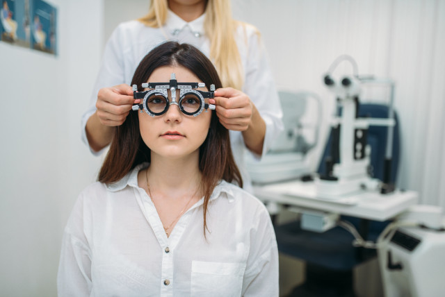 Woman at the optometrist (illustrative). (credit: INGIMAGE)