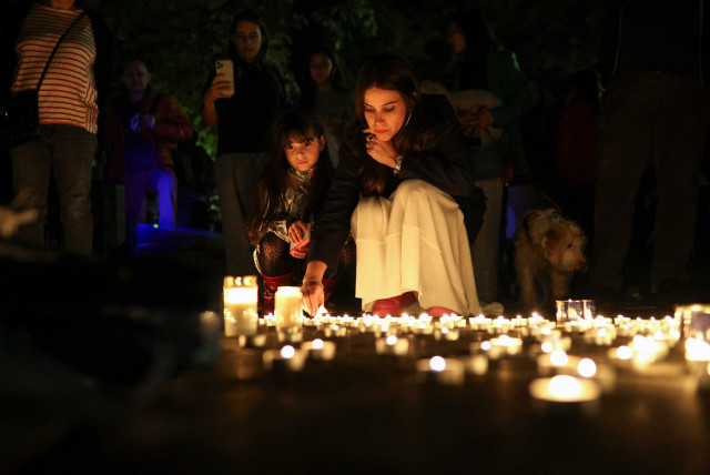  People attend a candlelight vigil for remembrance and solidarity with Israel in front of the Monument of the Salvation of the Bulgarian Jews in Sofia, Bulgaria, October 10, 2023.  (credit: REUTERS/SPASIYANA SERGIEVA)