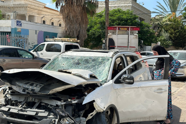  Destroyed cars litter the street following a rocket attack on Ramla, Israel, Oct. 12, 2023. (credit: DARIO SANCHEZ/THE MEDIA LINE)