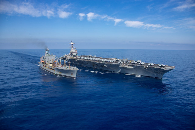  The world's largest aircraft carrier USS Gerald R. Ford steams alongside USNS Laramie (T-AO-203) during a fueling-at-sea in the eastern Mediterranean Sea, in this photo taken on October, 11, 2023 (credit: VIA REUTERS)