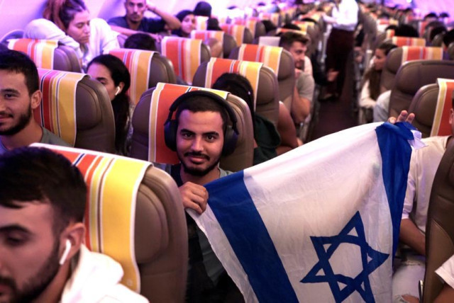 Israeli soldiers in the rescue plane on their way to Israel (credit: Aviram Hasson for Keren Hayesod)