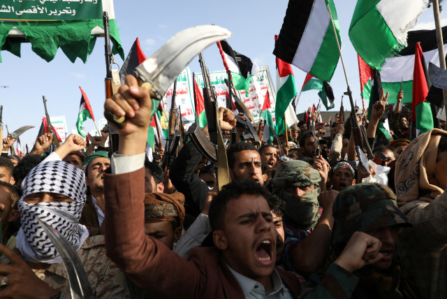 Men carry weapons as they protest in support of Palestinians in Gaza as the conflict between Israel and Hamas continues, in Sanaa, Yemen October 18, 2023.  (credit: KHALED ABDULLAH/REUTERS)