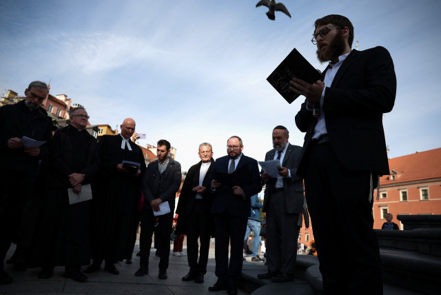  Rabbi Shai Welfeld prays during a multi-confessional prayer for peace after gunmen from Hamas entered Israeli territory on Saturday, at Old Town in Warsaw, Poland, October 13, 2023. (credit: REUTERS/KACPER PEMPEL)