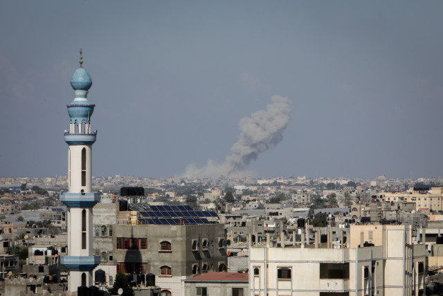 Smoke rises after Israeli airstrikes, of the city of Rafah in the southern Gaza Strip, on October 19, 2023 (credit: ABED RAHIM KHATIB/FLASH90)