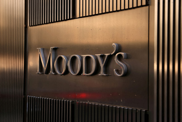  Signage is seen outside the Moody's Corporation headquarters in Manhattan, New York, U.S., November 12, 2021 (credit: REUTERS/FILE PHOTO)