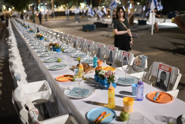  Families of Israelis held hostage by Hamas militants in Gaza set a Shabbat table with more than 200 empty seats for the hostages, at the ''Hostages Square'', outside the Art Museum of Tel Aviv, October 20, 2023. (credit: GILI YAARI /FLASH90)