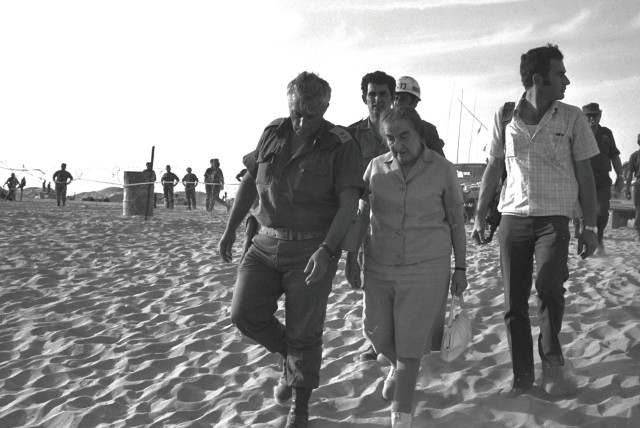  PRIME MINISTER Golda Meir with Maj. Gen. Ariel Sharon in the Sinai Peninsula in Oct. 1973.  (credit: Yehuda Tzion/GPO/Handout/Reuters)