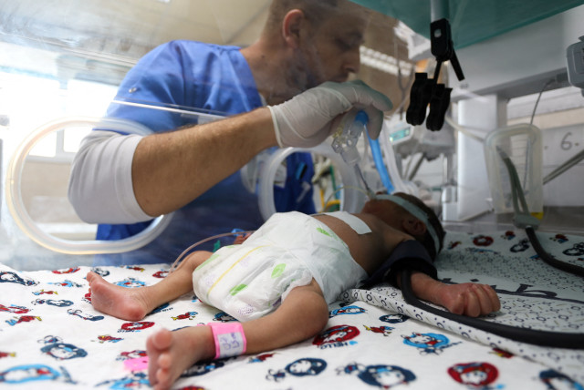 A premature Palestinian baby lies in an incubator at the maternity ward of Shifa Hospital, which according to health officials is about to shut down as it runs out of fuel and power, as the conflict between Israel and the terrorist Hamas continues, in Gaza City October 22, 2023. (credit: REUTERS/MOHAMMED AL-MASRI)