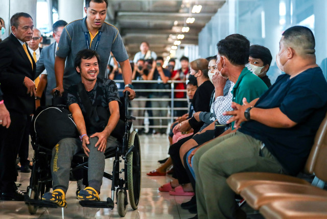  Katchakorn Pudtason, a migrant agricultural worker who was injured by a surprise attack on Israel by the Palestinian militant group Hamas, arrives after being repatriated from Israel at Bangkok's Suvarnabhumi Airport, Thailand, October 12, 2023.  (credit: REUTERS/Chalinee Thirasupa)
