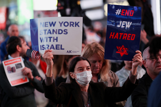  People attend a demonstration to express solidarity with Israel, amid the ongoing conflict between Israel and the Palestinian Islamist group Hamas, in New York City, U.S., October 19, 2023.  (credit: REUTERS/MIKE SEGAR)