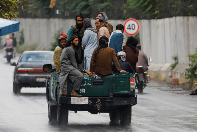  Taliban fighters drive a car on a street following the killing of Al Qaeda leader Ayman al-Zawahiri in a US strike over the weekend, in Kabul, Afghanistan, August 2, 2022.  (credit: ALI KHARA/REUTERS)