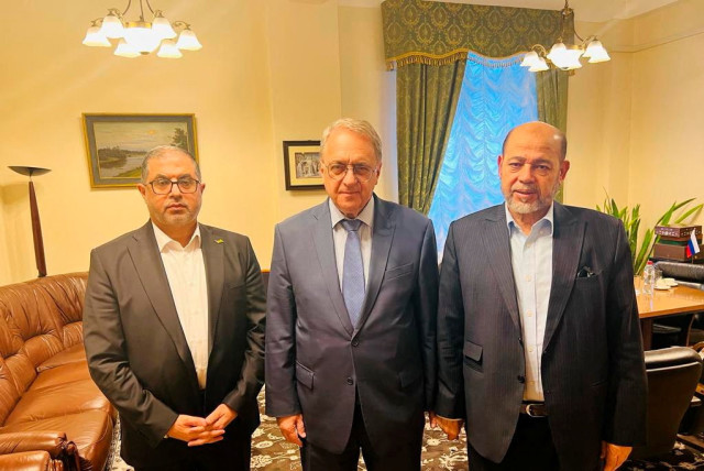  Senior Hamas officials Bassem Naim and Moussa Abu Marzouk, and Russia's Deputy Foreign Minister Mikhail Bogdanov meet for talks on the release of foreign hostages, at a location given as Moscow, Russia in this handout image released on October 26, 2023 (credit: Hamas Handout/Handout via REUTERS)