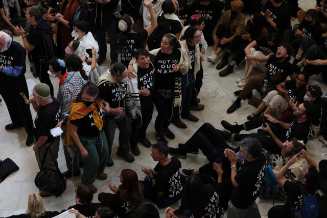  People demonstrate as they take part in civil disobedience and a protest calling for a ceasefire in Gaza, on Capitol Hill in Washington, U.S., October 18, 2023. (credit: REUTERS/LEAH MILLIS)
