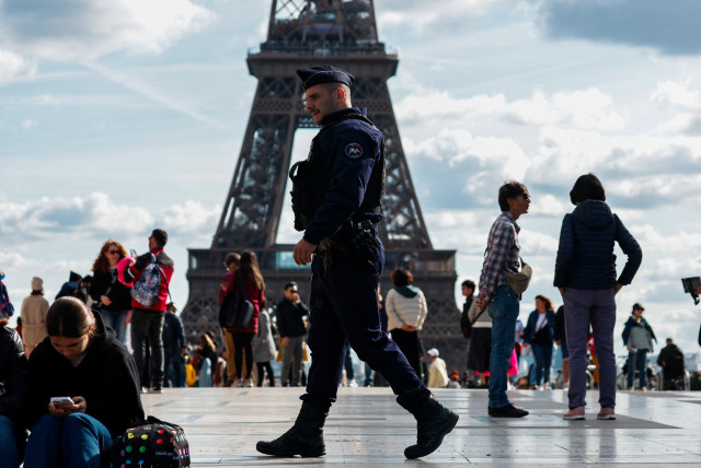  French police patrol at the Trocadero Square near the Eiffel Tower in Paris as French government puts nation on its highest state of alert after a deadly knife attack in northern France, October 15, 2023. (credit: REUTERS/GONZALO FUENTES)
