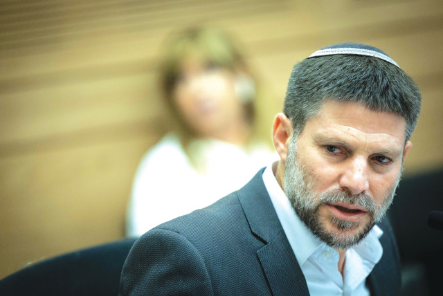  FINANCE MINISTER Bezalel Smotrich attends a discussion on the state budget, at the Knesset Finance Committee, in July. The state budget for 2024 and the next few years must be fundamentally redrafted, say the writers.  (credit: YONATAN SINDEL/FLASH 90)