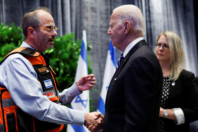  U.S. President Joe Biden shakes hands with Eli Beer, during a meeting with Israeli first responders, family members and other citizens directly impacted by the October 7th attack on Israel by Hamas, in Tel Aviv, Israel, October 18, 2023.  (credit: REUTERS/EVELYN HOCKSTEIN)