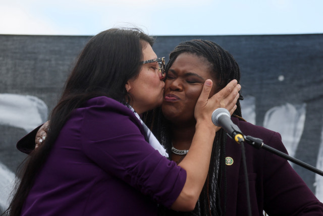  Rep. Rashida Tlaib (MI-12) kisses U.S. Rep. Cori Bush (D-MO) as they take part in a protest calling for a ceasefire in Gaza outside the U.S. Capitol, in Washington, U.S., October 18, 2023. (credit: REUTERS/LEAH MILLIS)