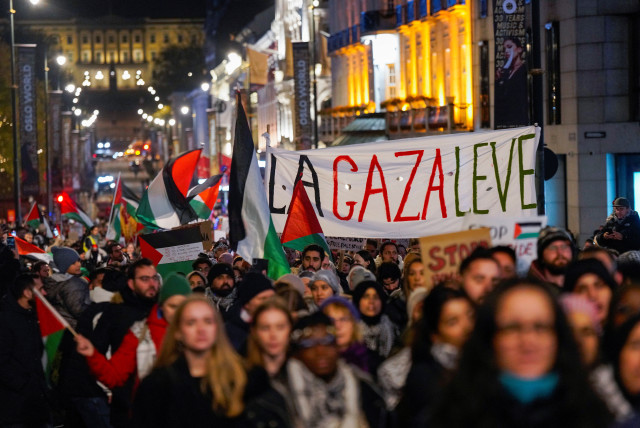  People attend a demonstration in support of Gaza and Palestinians, organised by the Palestine Committee, near the Royal Palace and the building of the Norwegian parliament, Stortinget, in Oslo, Norway, November 4, 2023.  (credit: NTB/Heiko Junge via REUTERS)