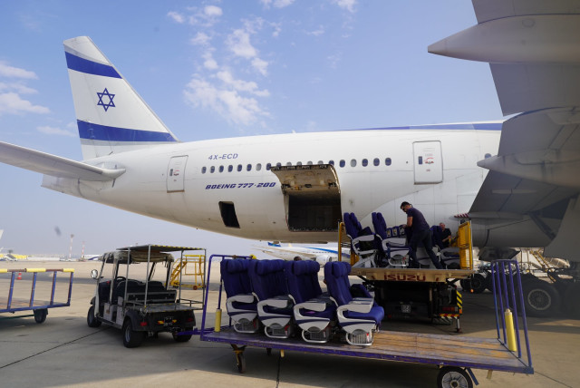  El Al employees remove passenger seats from a Boeing 777, so that the plane can be used to transport cargo to Israel during the ongoing war with Hamas in Gaza. (credit: EL AL on X)