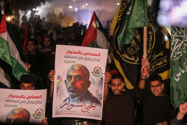  Supporters of Hamas leader Yahya Sinwar protest in Khan Younis, in the southern Gaza Strip, on May 7, 2022 (credit: ATTIA MUHAMMED/FLASH90)