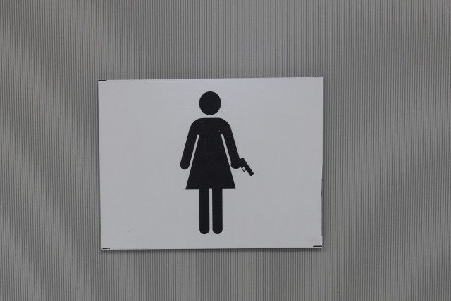  The sign for the women's bathroom at Caliber 3. (credit: MARC ISRAEL SELLEM/THE JERUSALEM POST)